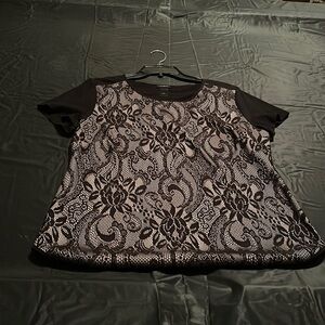 lace appliqué on front.  T shirt material on back. piped neckline & bottom